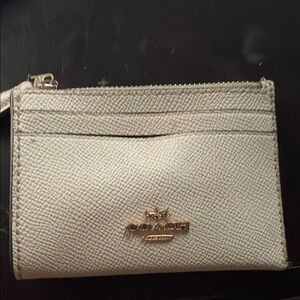 Coach White Wallet with Gold Hardware and Leather Texture
